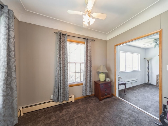 3812 Kingman Blvd, Des Moines, IA 50311 - spare room with a ceiling fan, a baseboard heating unit, and carpet floors