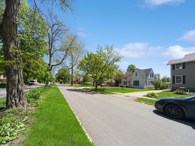 view of road with a residential view and sidewalks