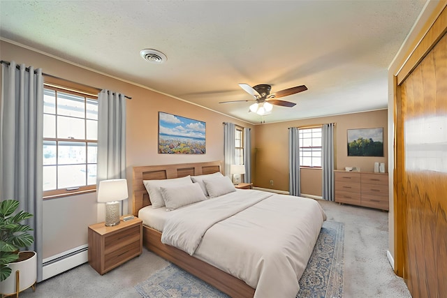 3812 Kingman Blvd, Des Moines, IA 50311 - bedroom featuring baseboard heating, light colored carpet, and a ceiling fan