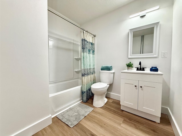full bathroom with wood finished floors and baseboards