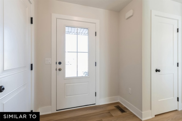 4112 NE 5th St, Ankeny, IA 50021 - doorway to outside featuring light wood-style flooring, baseboards, and visible vents