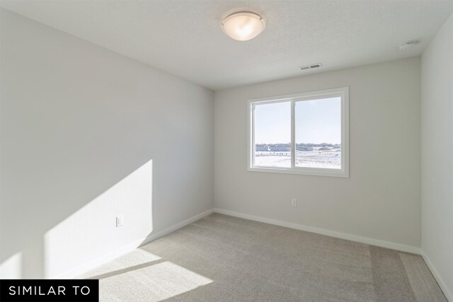 4112 NE 5th St, Ankeny, IA 50021 - unfurnished room featuring light colored carpet, visible vents, and baseboards