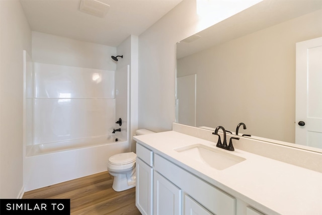 4112 NE 5th St, Ankeny, IA 50021 - full bathroom with toilet, wood finished floors, vanity, and shower / bathtub combination