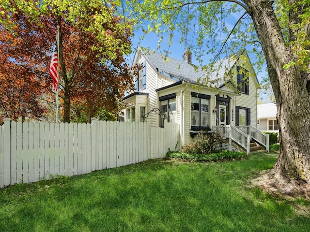 325 W 8th St S, Newton, IA 50208 - view of side of property featuring a chimney and a shingled roof