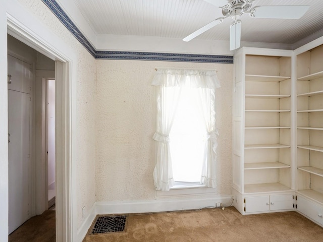 325 W 8th St S, Newton, IA 50208 - spare room featuring carpet floors, ceiling fan, crown molding, and baseboards