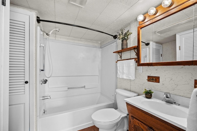 905 E 8th St S, Newton, IA 50208 - bathroom with a closet, vanity, washtub / shower combination, and toilet