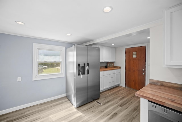 905 E 8th St S, Newton, IA 50208 - kitchen featuring appliances with stainless steel finishes, butcher block countertops, light wood-style floors, recessed lighting, and white cabinetry