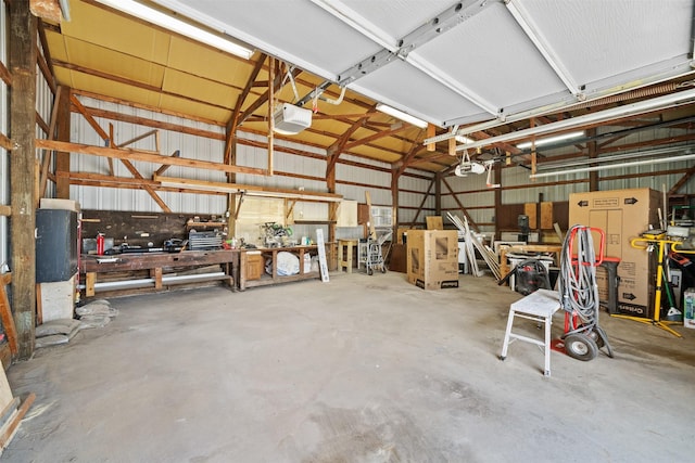 905 E 8th St S, Newton, IA 50208 - garage featuring a garage door opener and a workshop area