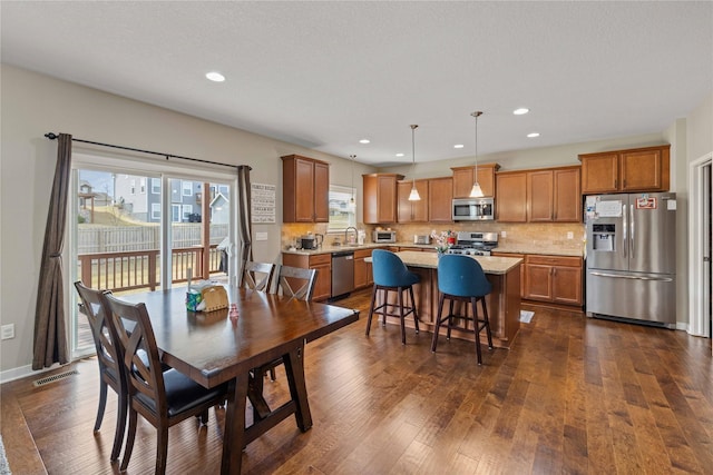 270 NE Prairie Wolf Dr, Waukee, IA 50263 - dining area with dark wood-type flooring and recessed lighting