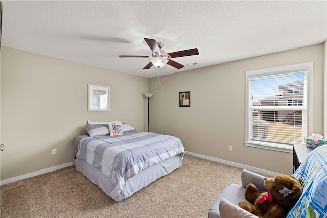 270 NE Prairie Wolf Dr, Waukee, IA 50263 - bedroom with carpet, baseboards, ceiling fan, and a textured ceiling