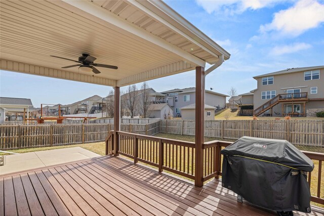 270 NE Prairie Wolf Dr, Waukee, IA 50263 - deck featuring a residential view, a ceiling fan, grilling area, and a fenced backyard