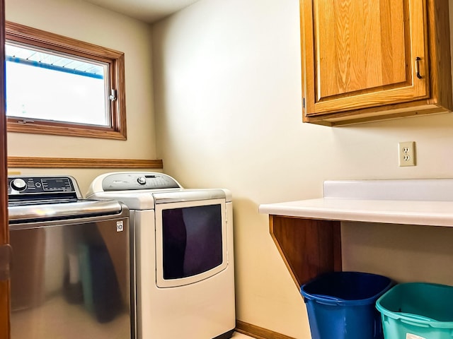 917 SE Allyn St, Ankeny, IA 50021 - washroom with cabinet space, baseboards, and washer and dryer
