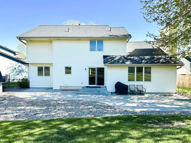 917 SE Allyn St, Ankeny, IA 50021 - rear view of house with a patio area, entry steps, roof with shingles, and fence