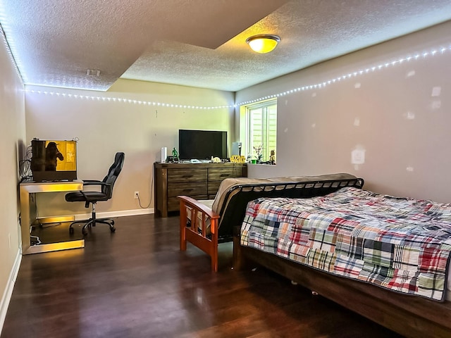 917 SE Allyn St, Ankeny, IA 50021 - bedroom with a textured ceiling, baseboards, and wood finished floors