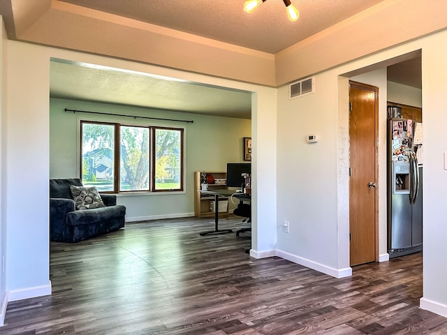 917 SE Allyn St, Ankeny, IA 50021 - office with a textured ceiling, visible vents, baseboards, and dark wood-type flooring