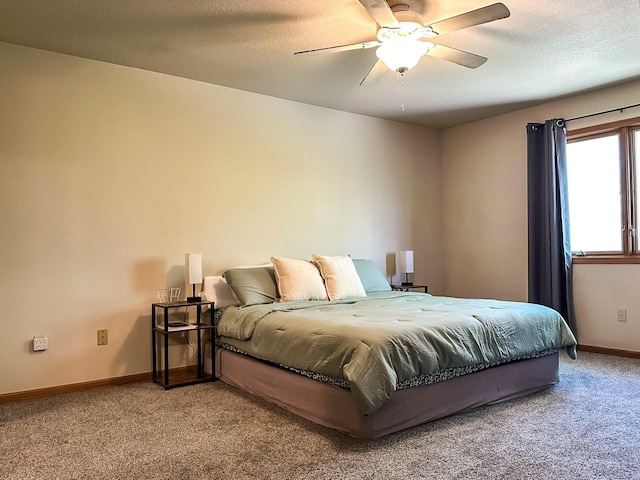 917 SE Allyn St, Ankeny, IA 50021 - bedroom with a textured ceiling, carpet, baseboards, and a ceiling fan