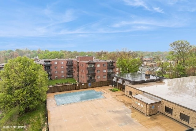 community pool with area for grilling and a patio area