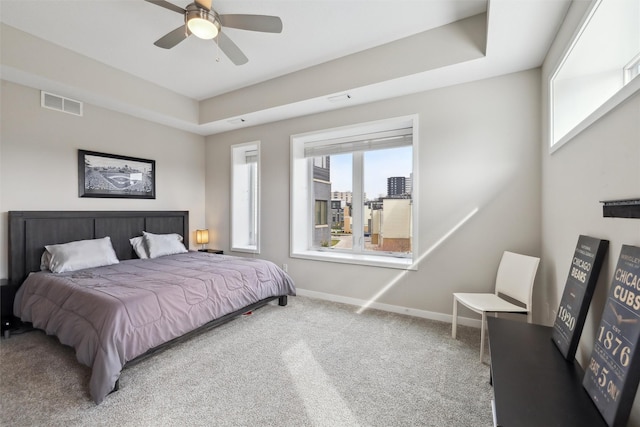 bedroom featuring ceiling fan, carpet flooring, baseboards, and visible vents