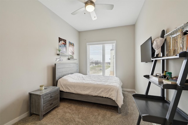 118 E Center St, Des Moines, IA 50309 - carpeted bedroom with baseboards and a ceiling fan