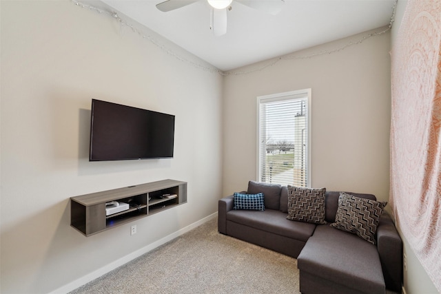 118 E Center St, Des Moines, IA 50309 - living area with carpet, ceiling fan, and baseboards