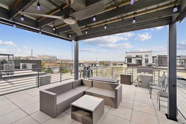 view of patio featuring a balcony, cooling unit, and ceiling fan