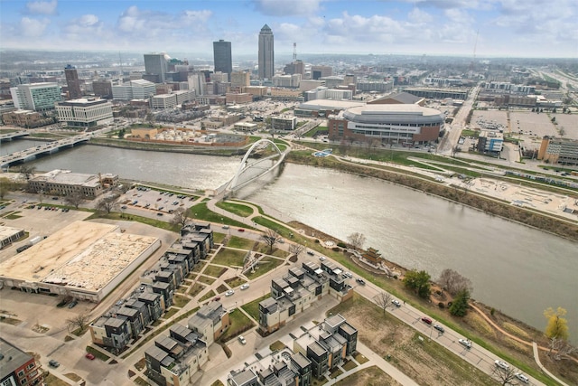 birds eye view of property featuring a water view and a view of city