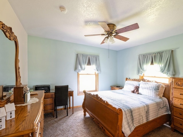 bedroom featuring a textured ceiling, baseboards, ceiling fan, and carpet floors