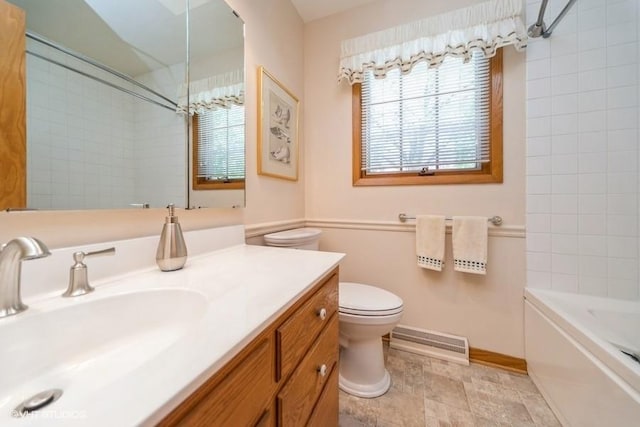 bathroom featuring toilet, baseboards, visible vents, vanity, and bathing tub / shower combination