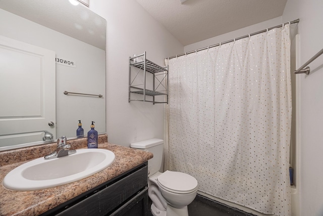 bathroom with curtained shower, vanity, and toilet
