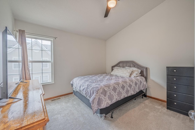 bedroom with baseboards, carpet flooring, a ceiling fan, and vaulted ceiling