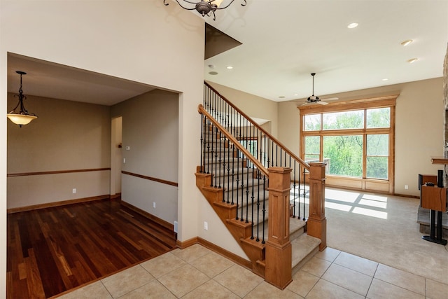 3803 SW 2nd Ct, Ankeny, IA 50023 - staircase with tile patterned floors, a ceiling fan, baseboards, and recessed lighting