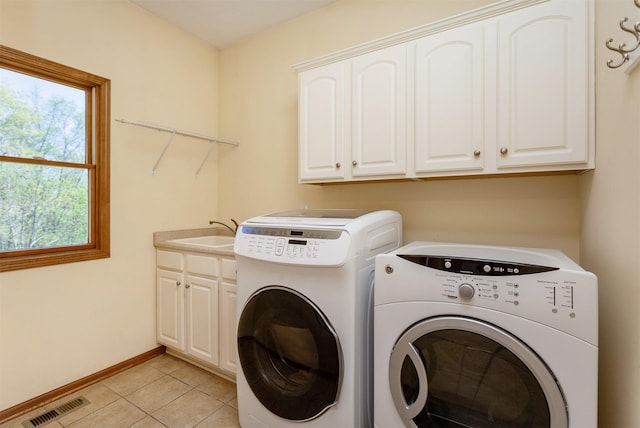 3803 SW 2nd Ct, Ankeny, IA 50023 - laundry area with cabinet space, independent washer and dryer, baseboards, and light tile patterned flooring