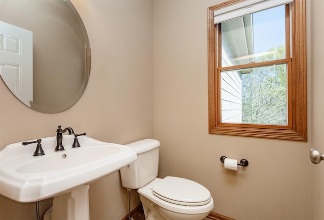 3803 SW 2nd Ct, Ankeny, IA 50023 - bathroom featuring toilet, baseboards, and a sink
