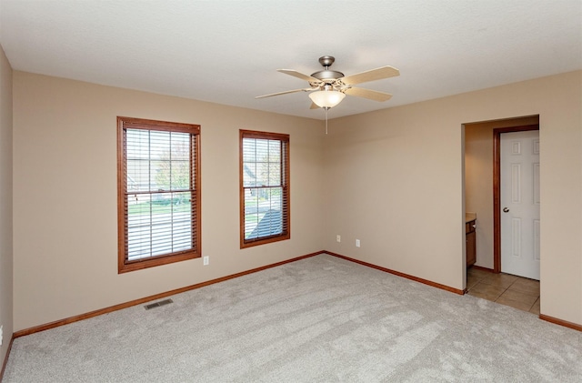3803 SW 2nd Ct, Ankeny, IA 50023 - empty room featuring light colored carpet, ceiling fan, and baseboards
