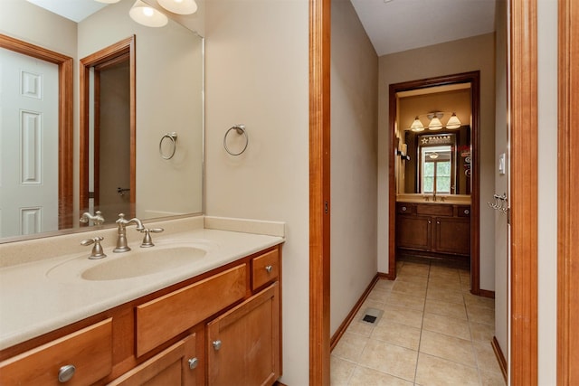 3803 SW 2nd Ct, Ankeny, IA 50023 - bathroom with tile patterned floors, vanity, and baseboards