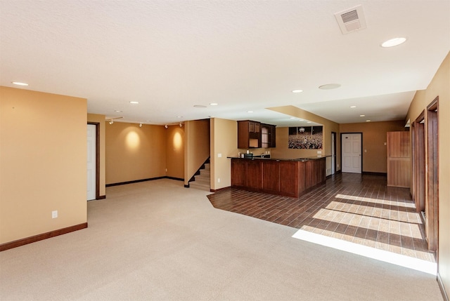 3803 SW 2nd Ct, Ankeny, IA 50023 - unfurnished living room featuring carpet flooring, baseboards, stairs, and recessed lighting