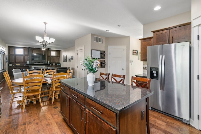 3414 163rd St, Urbandale, IA 50323 - kitchen featuring stainless steel fridge, a chandelier, dark wood-style flooring, a center island, and recessed lighting