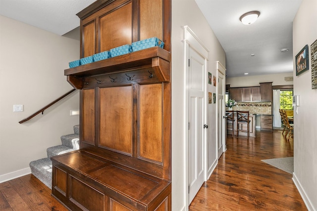 3414 163rd St, Urbandale, IA 50323 - mudroom featuring dark wood-style flooring and baseboards