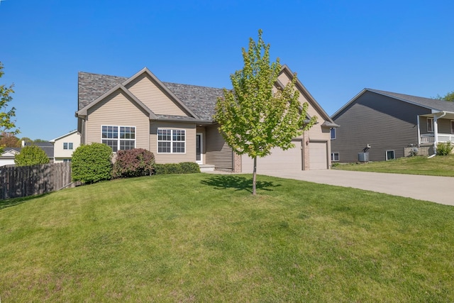 view of front of home with driveway, central AC unit, and a garage