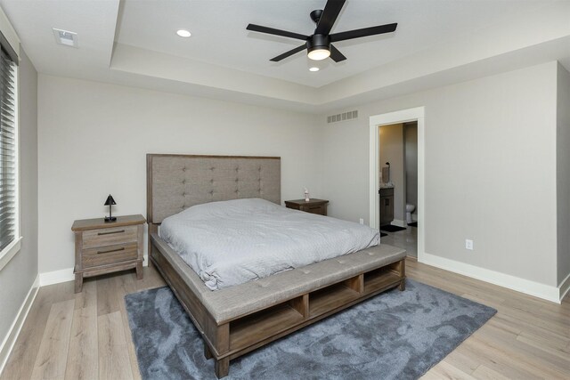 730 NE Country Meadow Dr, Ankeny, IA 50021 - bedroom featuring light wood finished floors, a tray ceiling, baseboards, recessed lighting, and a ceiling fan