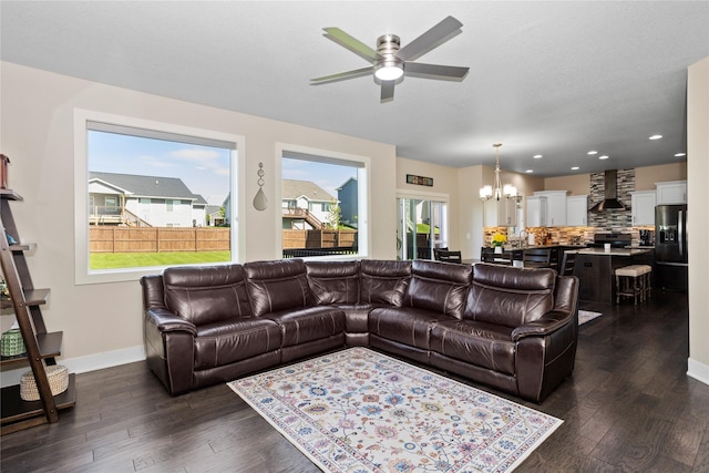 465 NW Gracewood Dr, Waukee, IA 50263 - living room featuring a chandelier, a ceiling fan, dark wood-type flooring, and recessed lighting