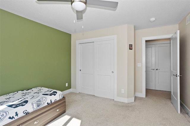 465 NW Gracewood Dr, Waukee, IA 50263 - bedroom with light colored carpet, a closet, and ceiling fan