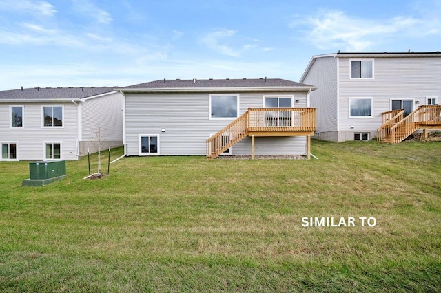 4404 Honey Bee Rdg, Des Moines, IA 50317 - back of house featuring stairs, a deck, and a yard