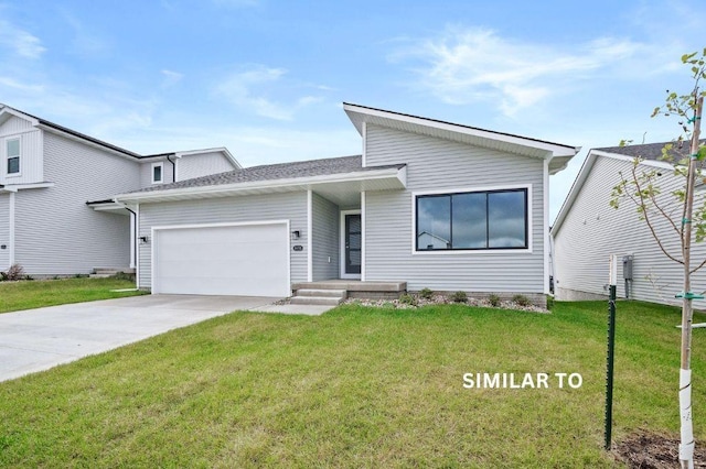 4404 Honey Bee Rdg, Des Moines, IA 50317 - view of front of home with a garage, a front lawn, and concrete driveway
