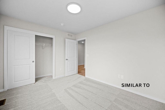 4404 Honey Bee Rdg, Des Moines, IA 50317 - unfurnished bedroom featuring baseboards, carpet, and a closet