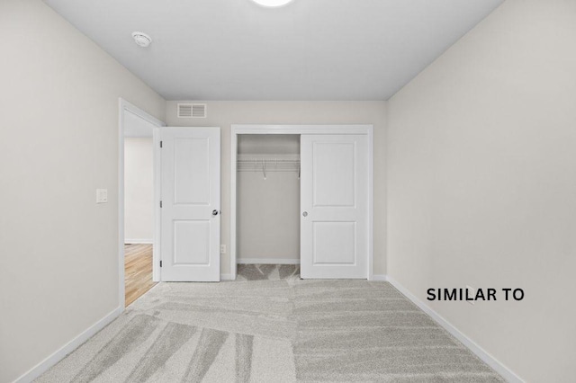 4404 Honey Bee Rdg, Des Moines, IA 50317 - unfurnished bedroom with carpet flooring, baseboards, and a closet