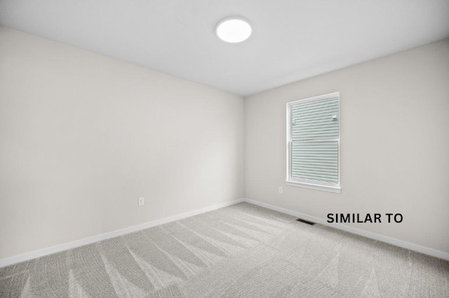 4404 Honey Bee Rdg, Des Moines, IA 50317 - carpeted spare room featuring baseboards