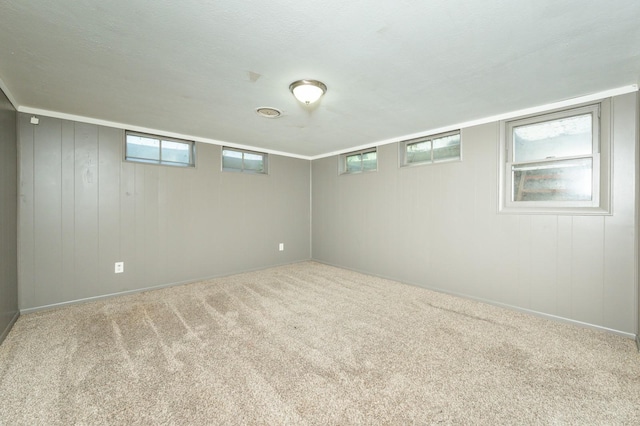 1702 17th St, West Des Moines, IA 50265 - below grade area with healthy amount of natural light, carpet floors, and baseboards