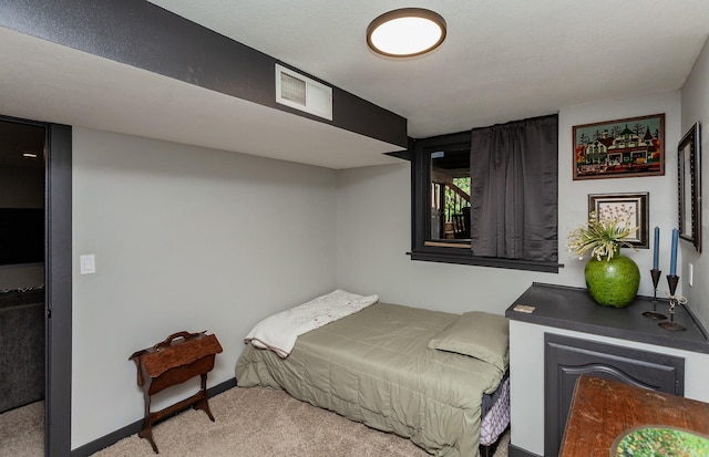 bedroom featuring carpet floors and baseboards