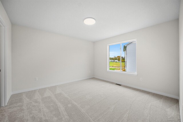 4408 Honey Bee Rdg, Des Moines, IA 50317 - spare room featuring carpet flooring and baseboards